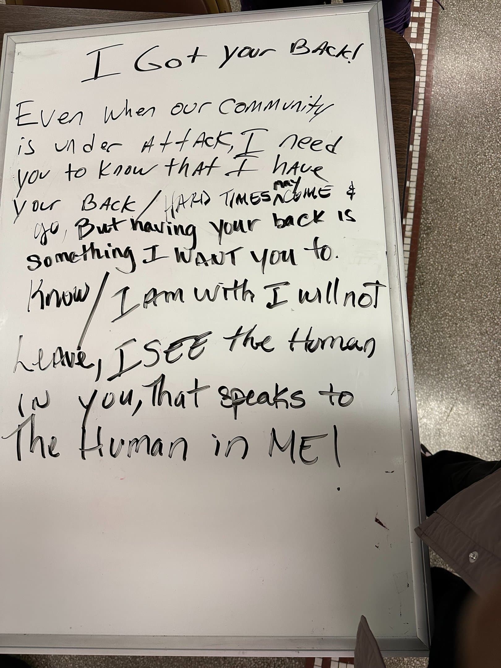 Handwritten collective poem titled I Got Your Back and the human in ME on a whiteboard